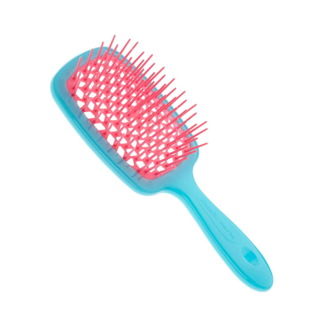 Blue and pink hairbrush on a white background